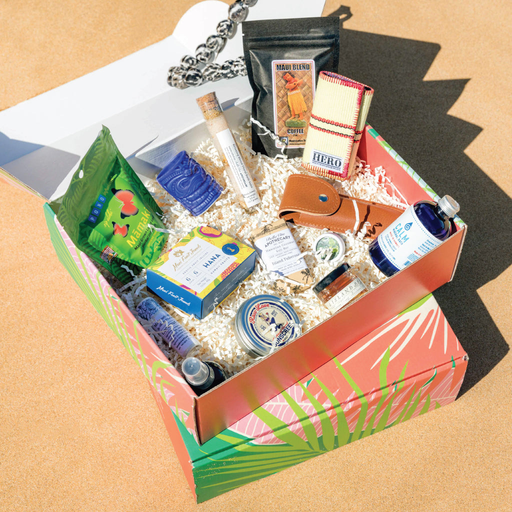 Aloha Boxed products showcased on Maui sand